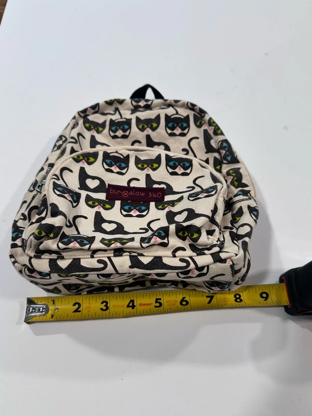 bungalow 360 Cream Mini Backpack with Black Cat Print and Colorful Eyes